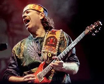 Kadafi tocando la guitarra