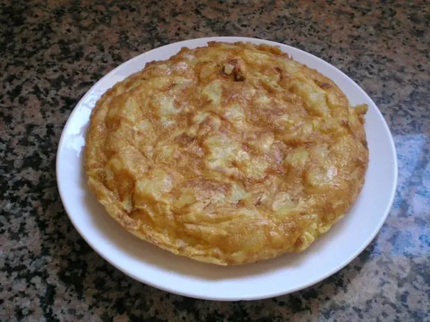 española