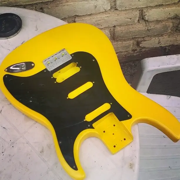 como arreglar una guitarra